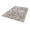 Beiger Teppich mit schwarzem Blumenmuster