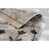 Beiger Teppich mit schwarzem Blumenmuster