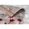 Beiger Teppich mit rotem Blumenmuster