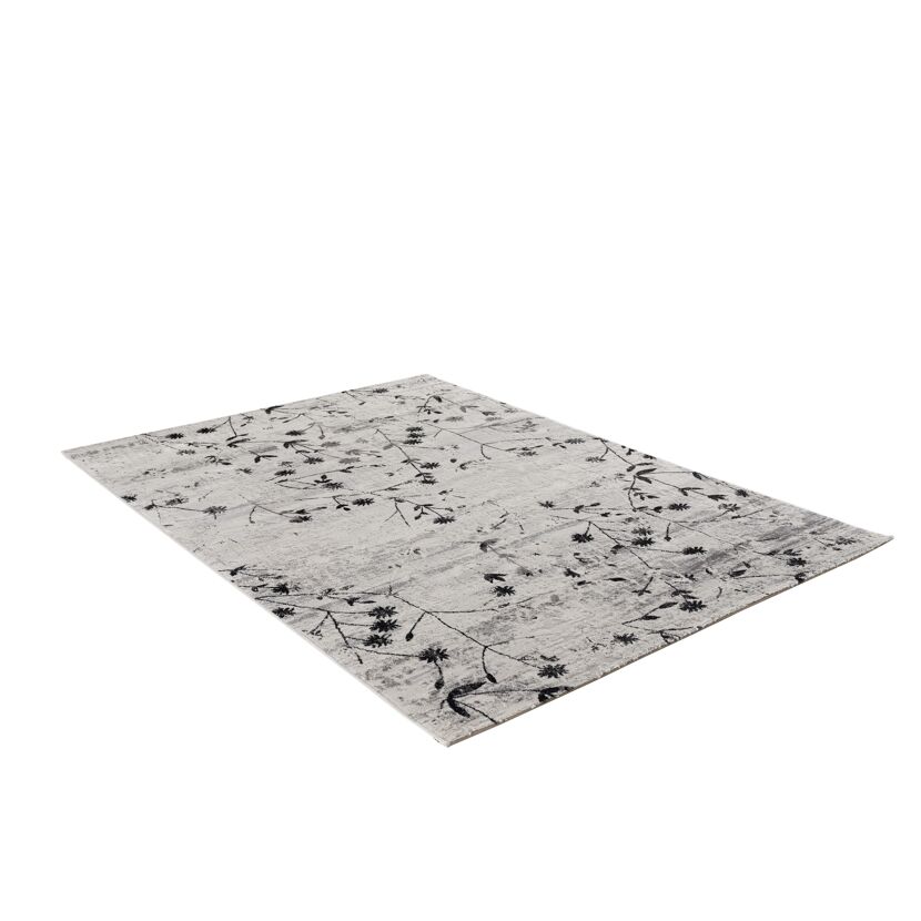 Beiger Teppich mit schwarzem Blumenmuster