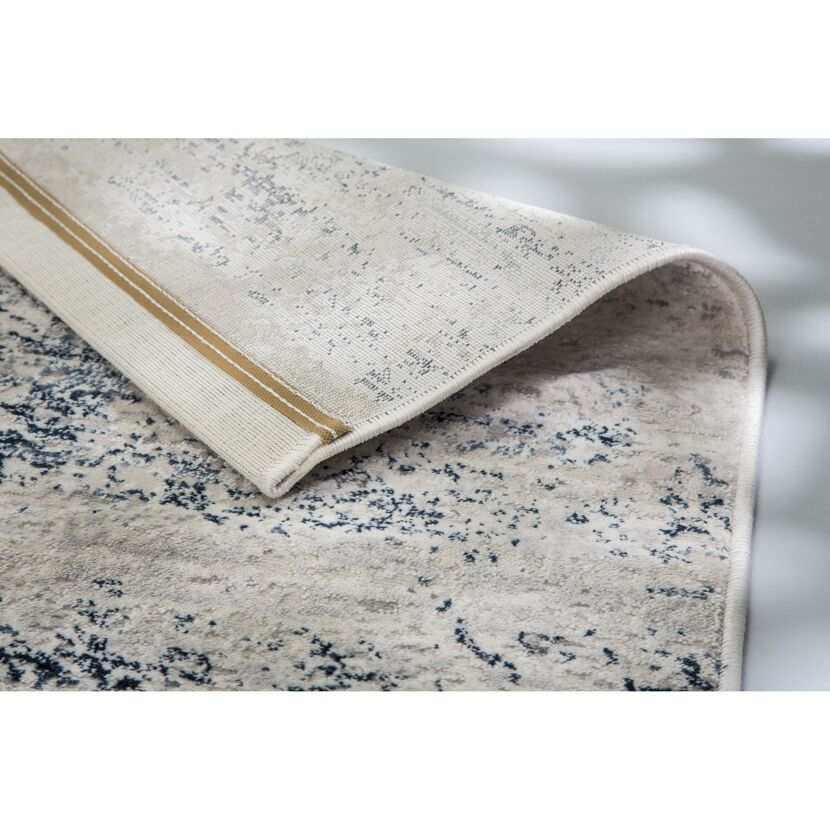 Beigefarbener Teppich mit Muster