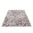 Beiger Teppich mit rotem Blumenmuster