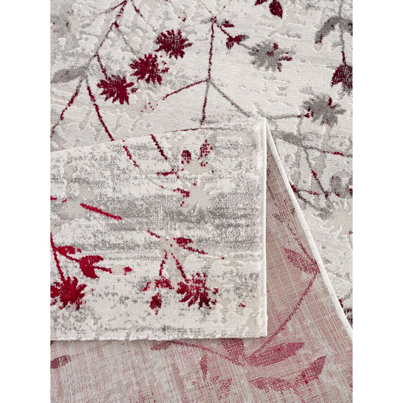 Beiger Teppich mit rotem Blumenmuster