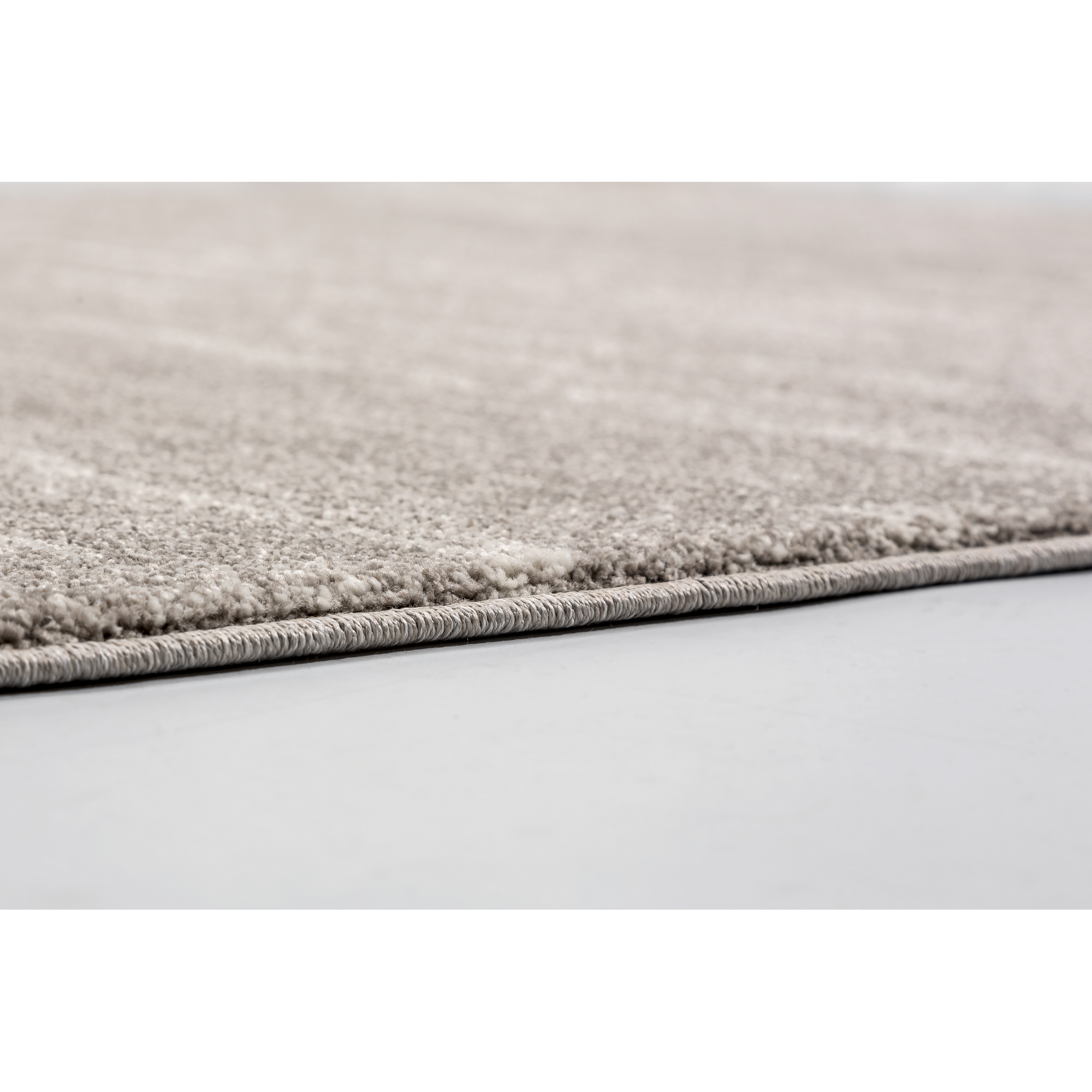 Beigefarbener Teppich Detailaufnahme
