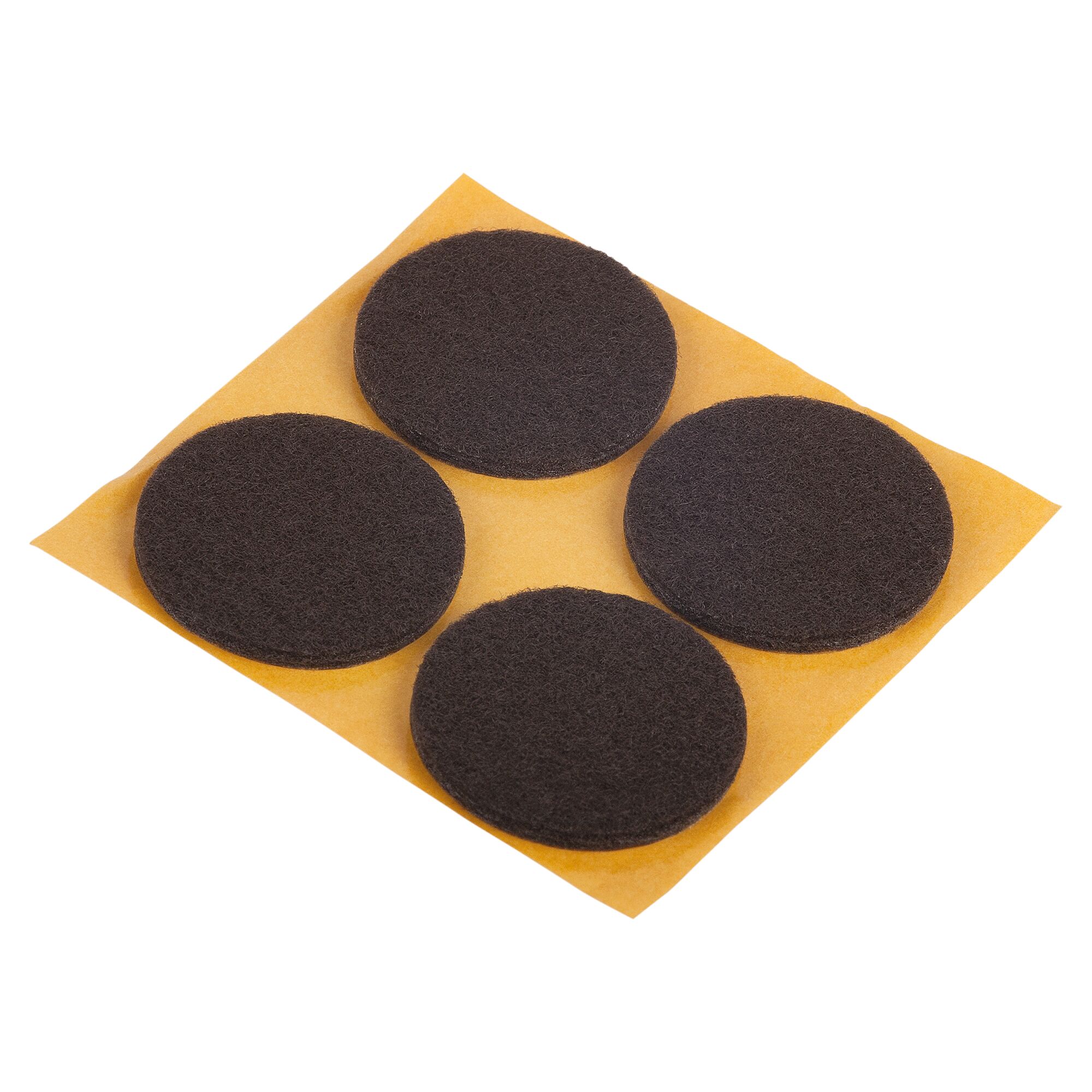 Vier selbstklebende Filzgleiter auf Trägerpapier