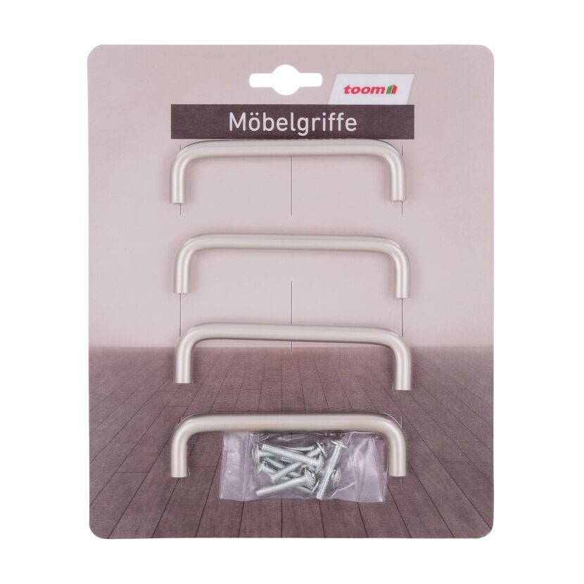 Vier silberne Möbelgriffe und Schrauben in Verpackung