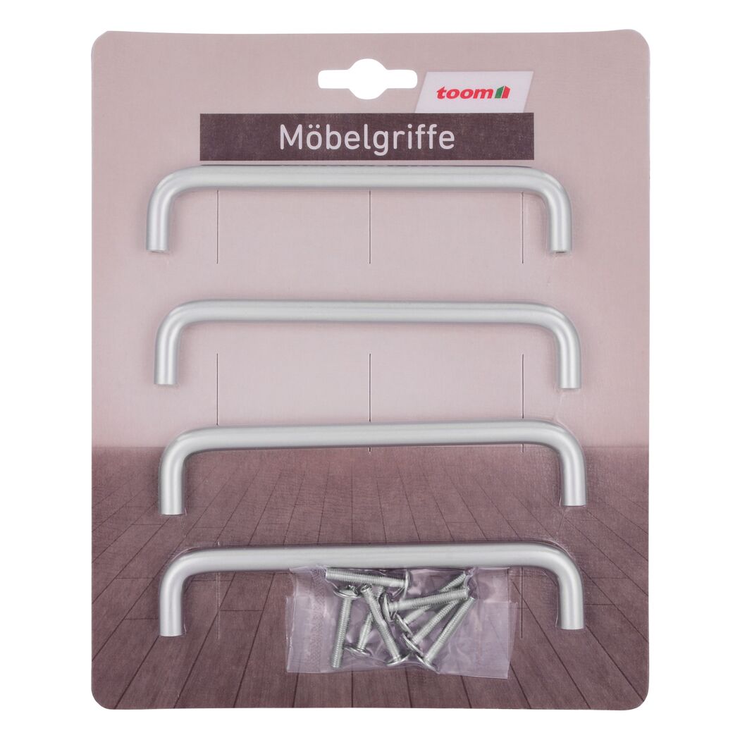 Vier silberne Möbelgriffe und Schrauben in Verpackung
