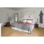 Schlafzimmer mit Laminatboden in Eichenoptik