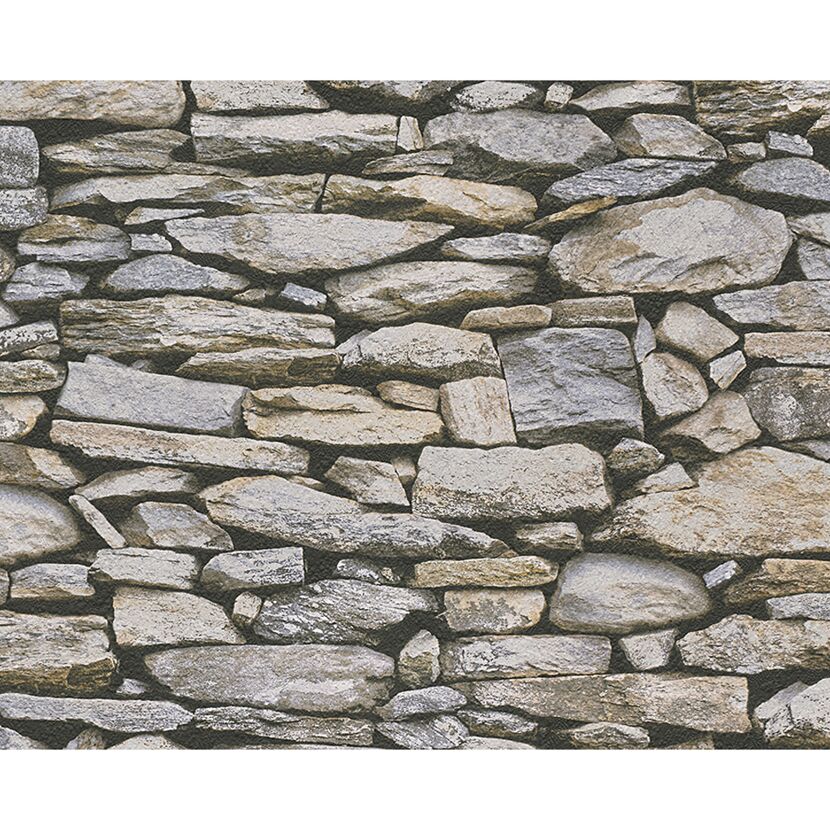 Eine Wand aus grauen und beigen Steinen.