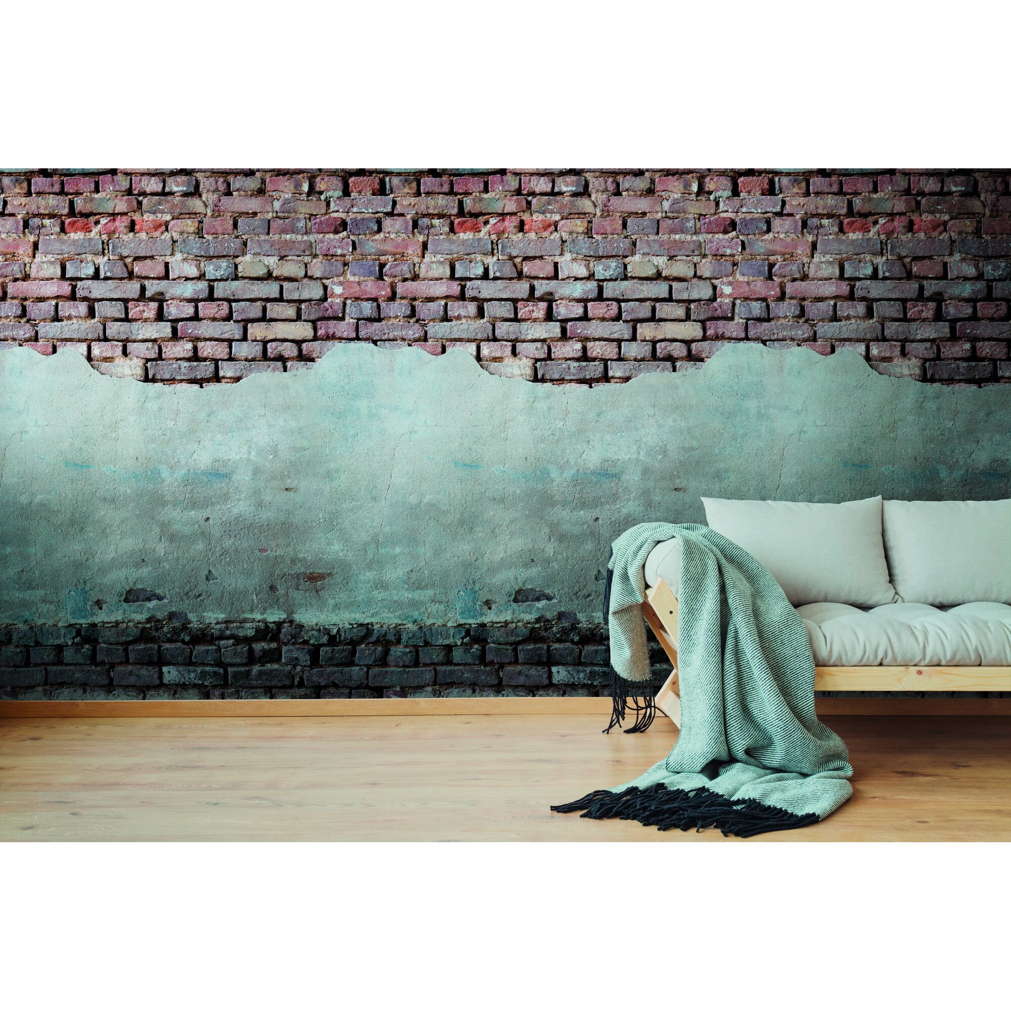 Sofa vor Backsteinwand