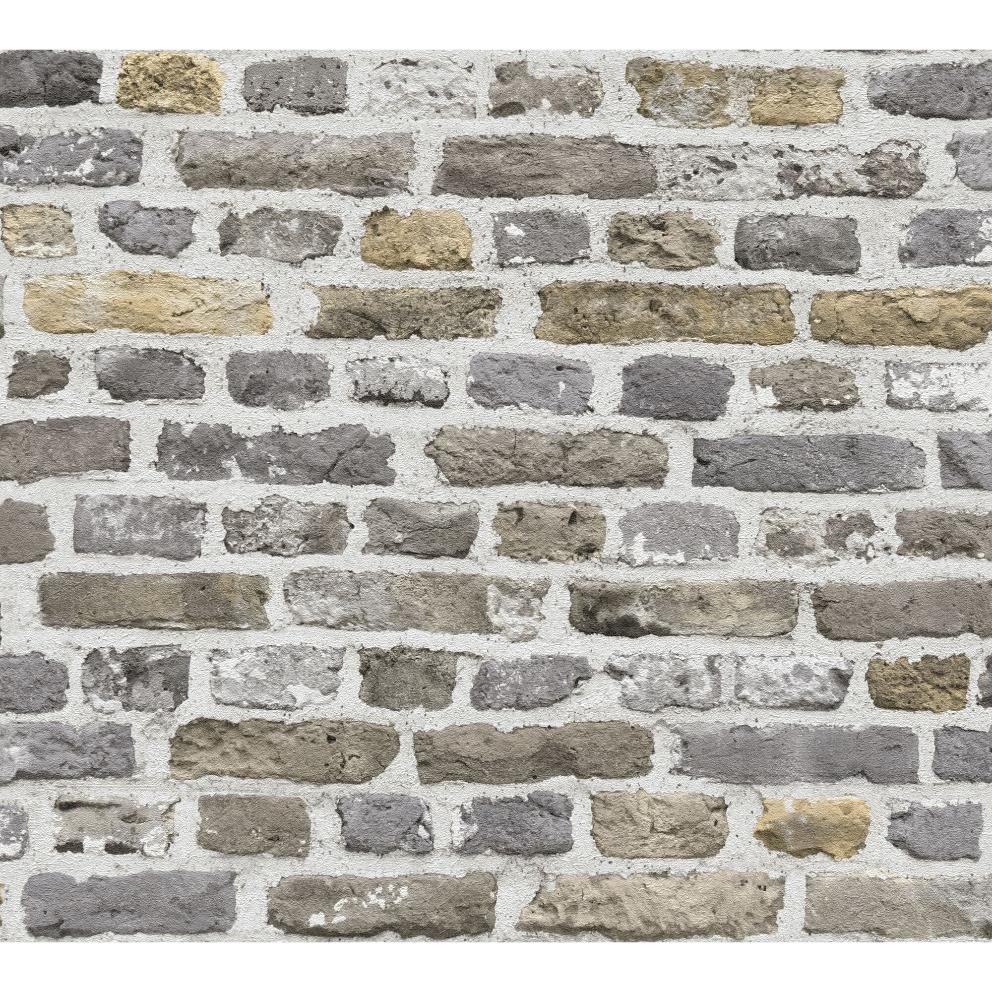 Graue und beige Ziegelwand