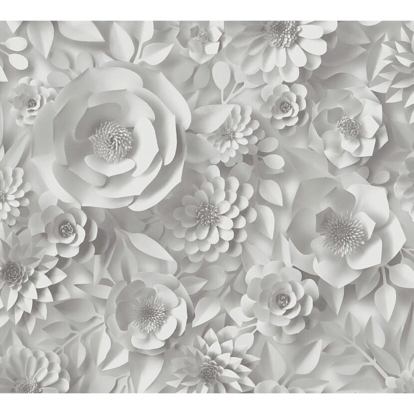 Weiße Papierblumen auf grauem Hintergrund.