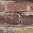 Nahaufnahme einer roten Backsteinwand