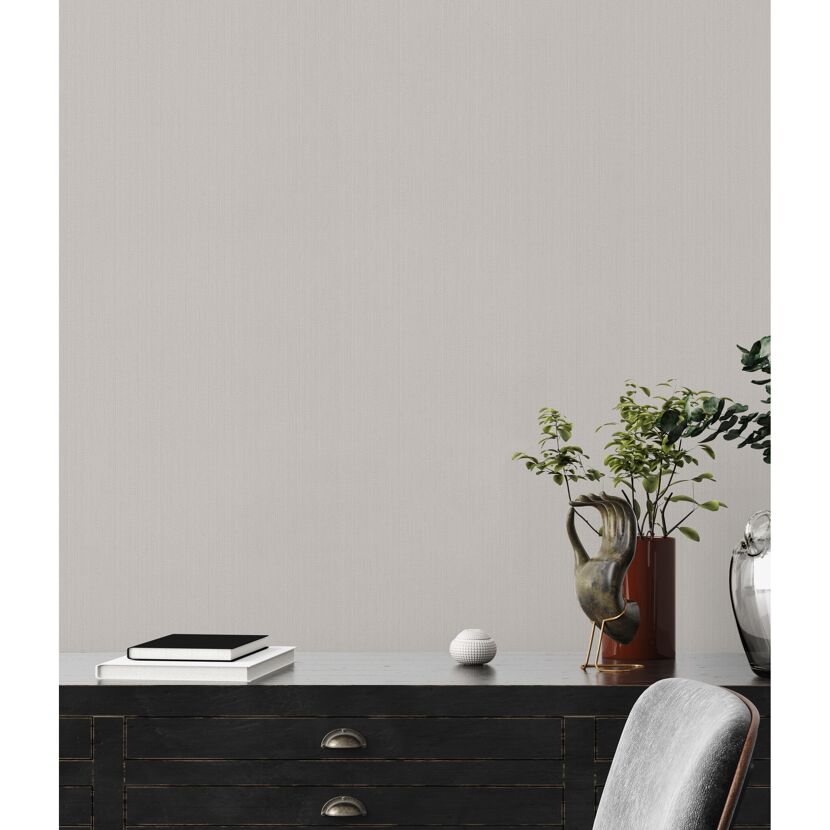 Vliestapete The BoS Uni in Beige an der Wand