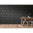 Esszimmer mit schwarz-goldener Vliestapete The BoS Betonwand