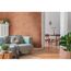 Wohnzimmer mit mintgrünem Sofa und kupferfarbener Wand