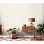 Beige Vliestapete "Mesto" mit Wellenmuster an der Wand