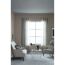 Wohnzimmer mit Sofa, Sessel und Fenster in der Farbe Manhattan