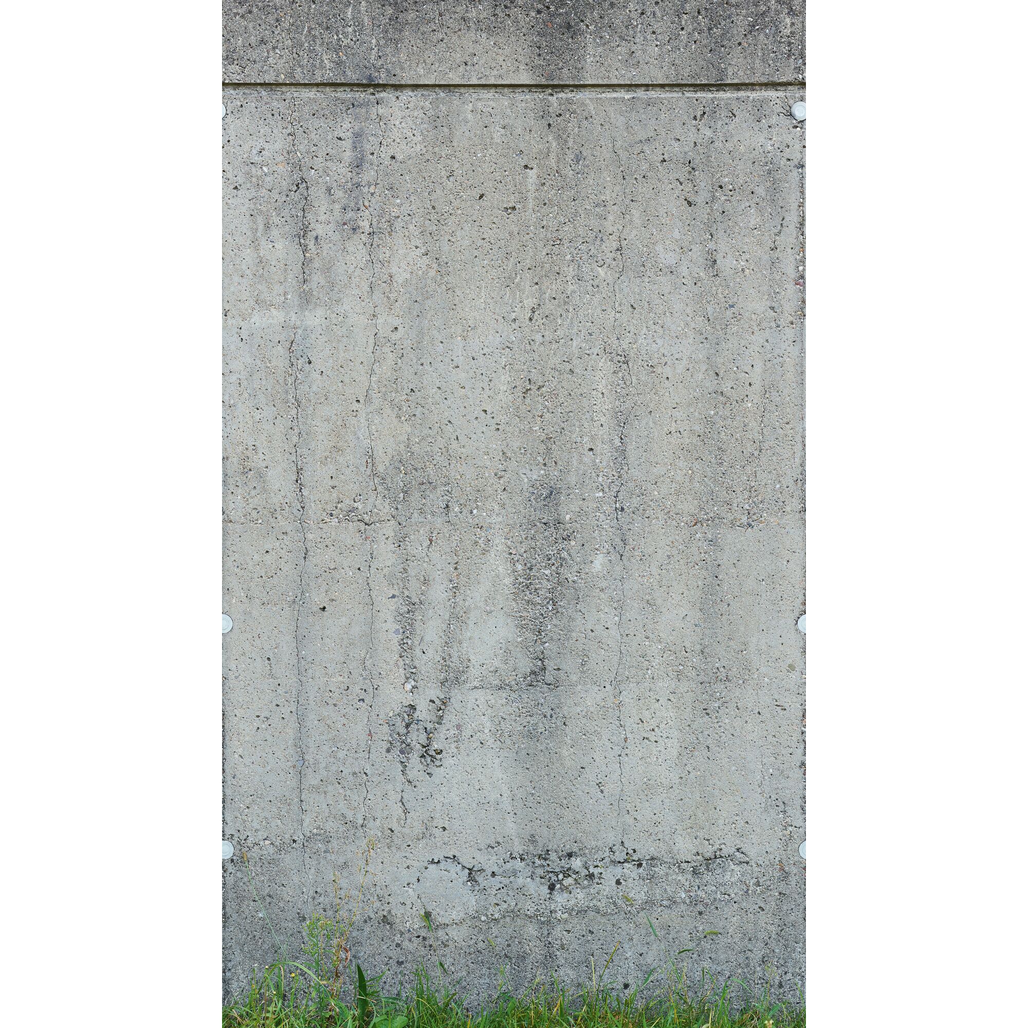 Graue Betonwand mit Rissen