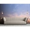 Sofa vor einer Fototapete mit Dämmerungshimmel