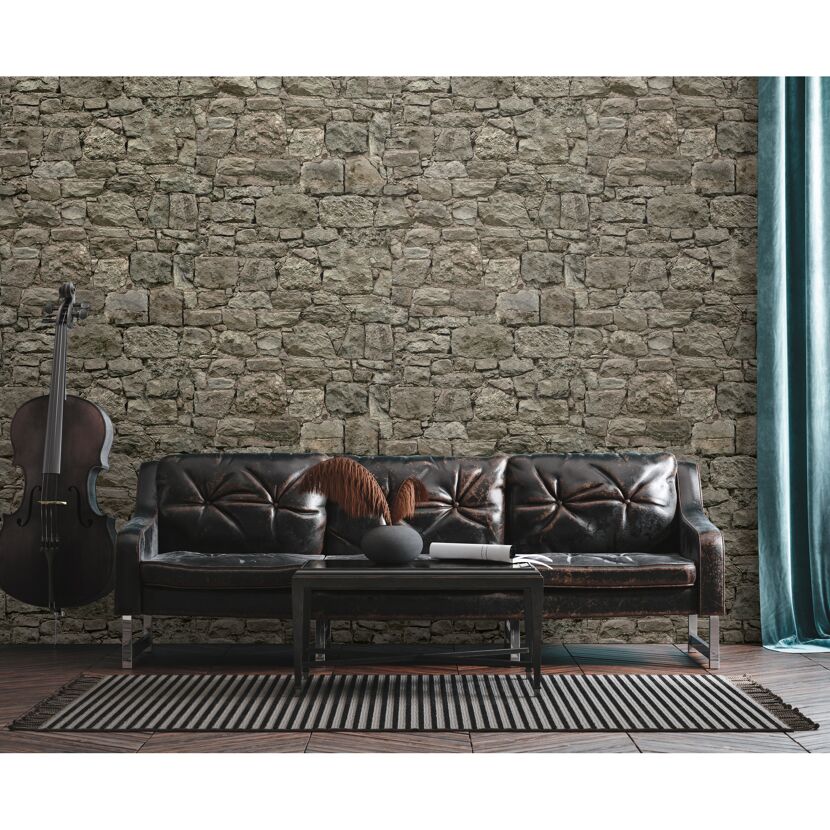 Ledercouch an Steinwand