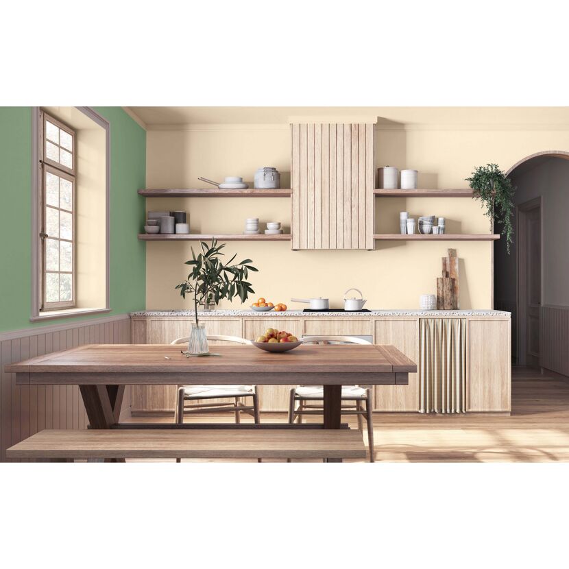 Küche in Beige und Grün mit Esstisch