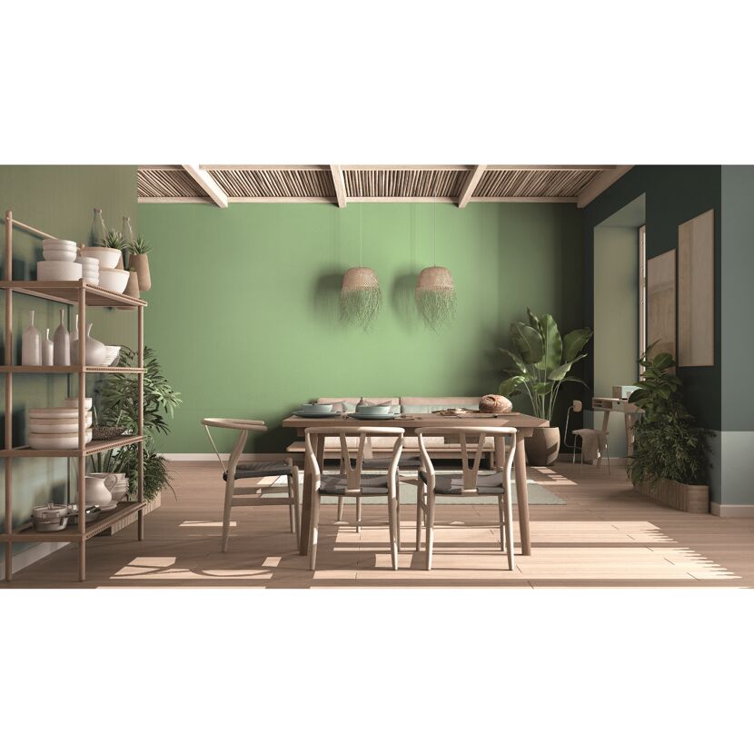 Esszimmer mit mintgrüner Wand und Holzmöbeln