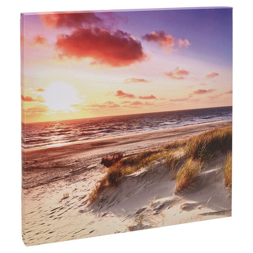 Sonnenuntergang am Strand mit Dünengras