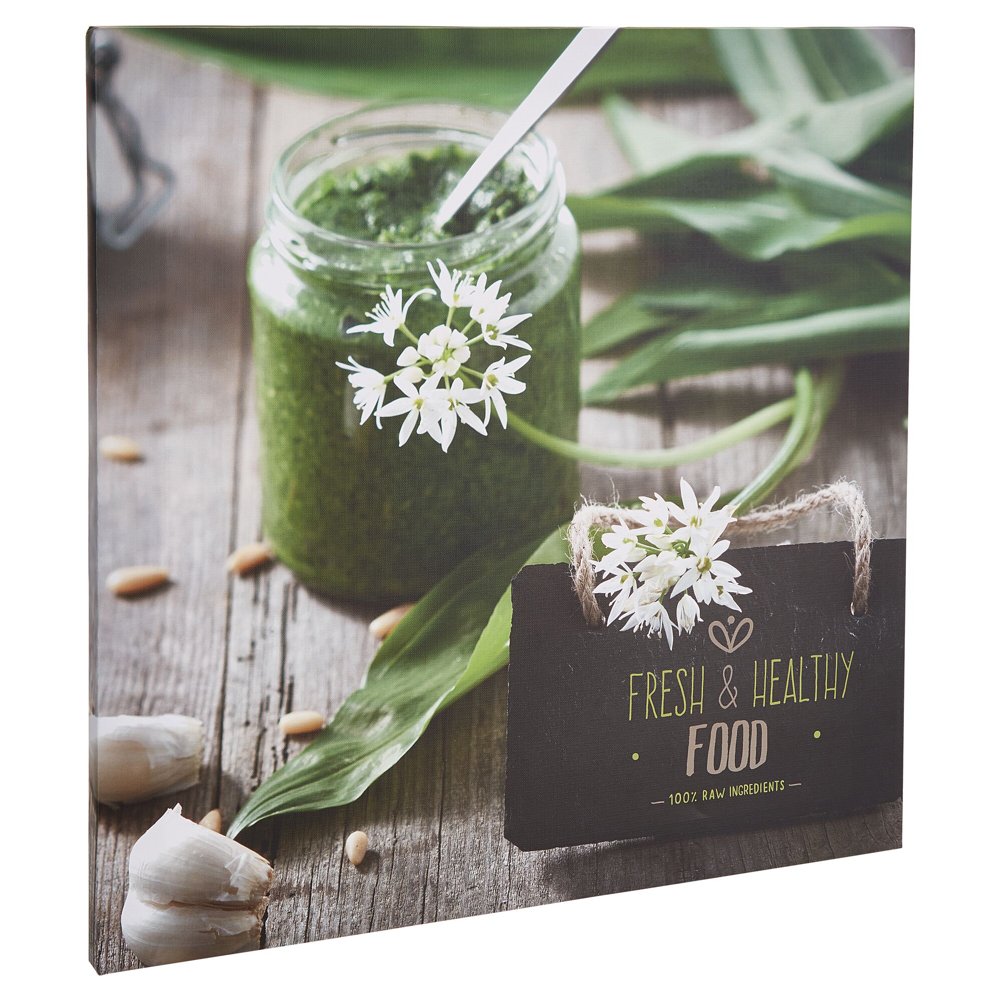 Glas mit Bärlauchpesto, Bärlauchblüten und Pinienkernen