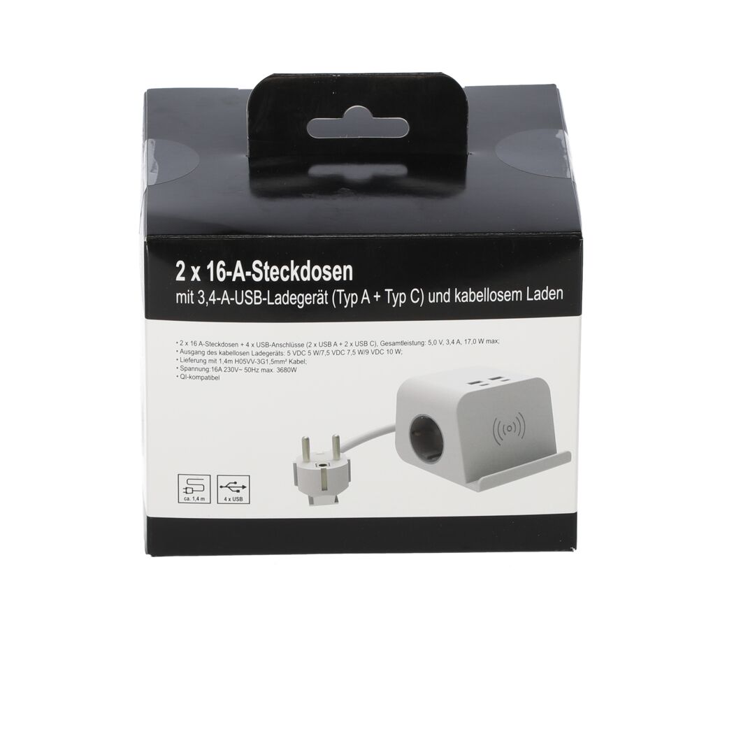 Verpackung einer weißen Schnellladestation mit USB und Kabellos-Ladefunktion.