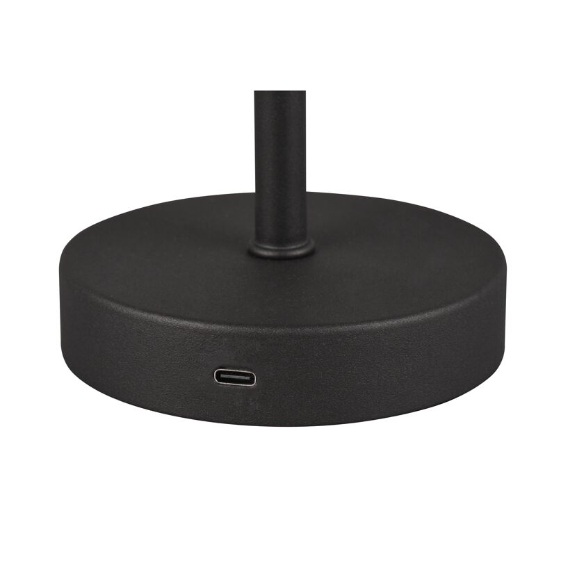 Fuß einer schwarzen Tischleuchte mit USB-Anschluss