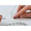 Person zieht Schutzfolie von LED-Strip ab