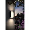 Schwarze LED-Wandleuchte Turaco an Hauswand