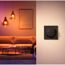 Schwarzer Funkschalter 'Hue Tap Dial' an der Wand