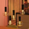 Fünf leuchtende LED-Leuchtmittel 'Hue' dimmbar in klarem Glas.