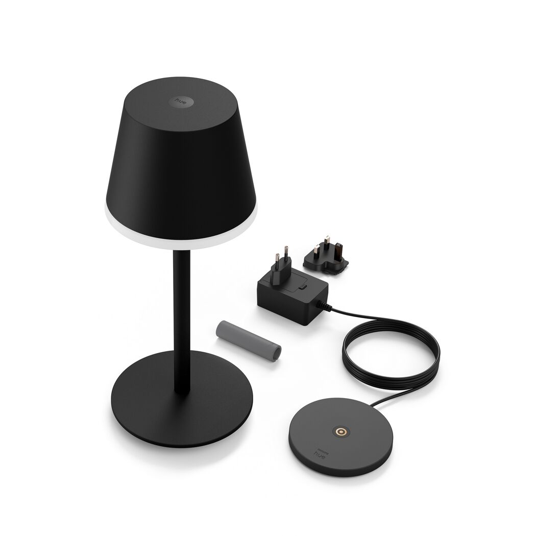 Schwarze Tischleuchte Hue Bloom mit Ladekabel und Adaptern.