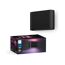 Schwarze Philips Hue Wandleuchte, daneben Verpackung