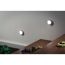 Zwei runde LED-Wandleuchten an einer Wand neben einer Treppe.