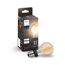 LED-Leuchtmittel 'Hue White' Tropfen gold E27 und Verpackung.