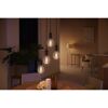 Vier goldene Hue Filament LED-Leuchtmittel über Esstisch.