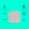 Grauer Portable Button mit An/Aus-Funktion und Helligkeitsregelung.
