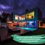 LED-Panel 'Magic Panel' in modernem Haus mit Pool und Garten.