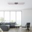 Modernes Wohnzimmer mit grauer Couch und Sessel