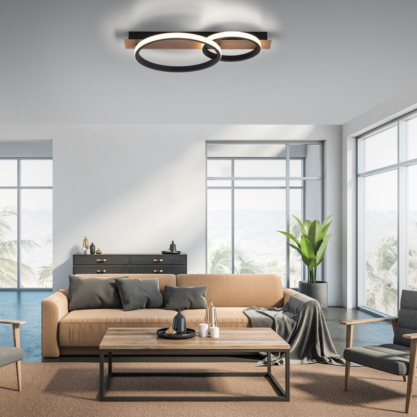 Wohnzimmer mit braunem Sofa, Couchtisch und modernen LED Deckenleuchten