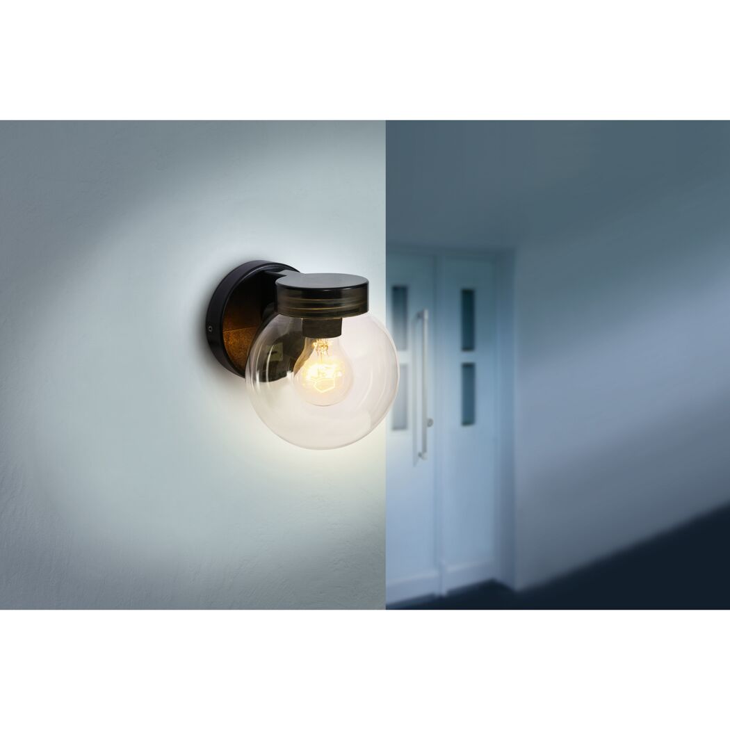 Schwarze runde Wandleuchte an Wand