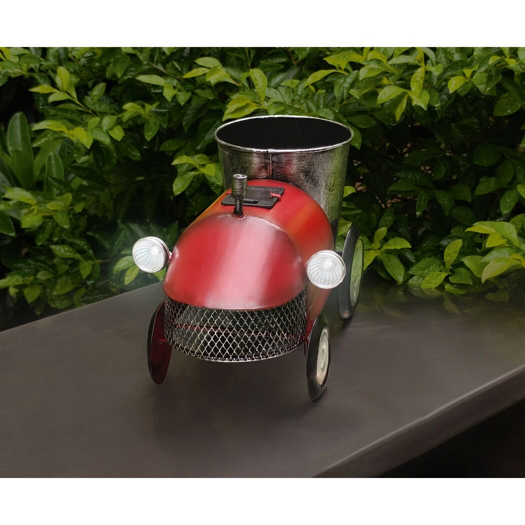 Roter Deko-Trecker mit Blumentopf