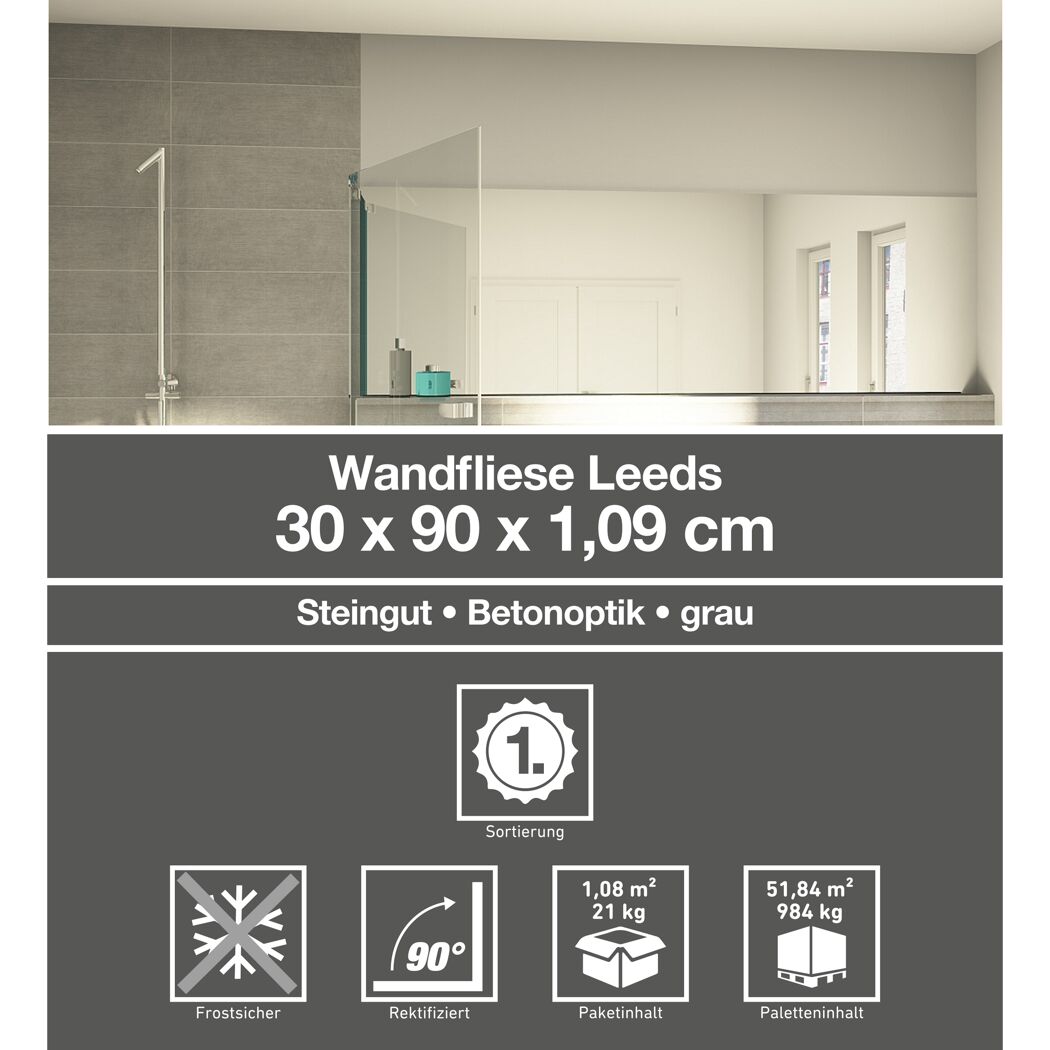 Graue Wandfliesen in Betonoptik verlegt im Badezimmer