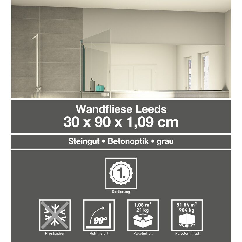 Graue Wandfliesen in Betonoptik verlegt im Badezimmer